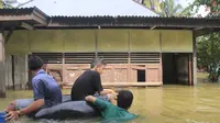 Bocah 10 Tahun Terseret Banjir di Kampar