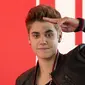 Justin Bieber dikabarkan masih belum bisa melupakan Selena Gomez meski telah menggandeng wanita lain (AP Files)