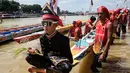 Dalam cerita masyarakat sekitar, Pacu Jalur merupakan lomba balap perahu atau sampan yang telah dilakukan ratusan tahun. (Wahyudi/AFP)