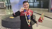 Sandi Firmansyah merebut emas di cabor karate SEA Games 2023. Selain sebagai atlet karate, Sandi merupakan prajurit TNI aktif. (Liputan6.com)
