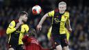 Pemain Watford, Kiko Femenia, duel udara dengan penyerang Liverpool, Sadio Mane pada laga Premier League di Stadion Vicarage Road, Sabtu (29/2/2020). Watford menang 3-0 atas Liverpool. (AP/Alastair Grant)