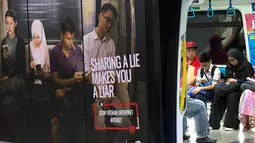 Iklan larangan penyebaran hoax atau berita bohong terpasang pada kereta di Stasiun Kereta Kuala Lumpur, Malaysia, Kamis (29/3). Penyebar hoax bakal dikenai hukuman enam tahun penjara. (AP Photo/Vincent Thian)