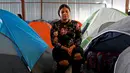 Imigran El Salvador Gabriela Orellana (25) berpose di dalam tempat penampungan di Tijuana, Meksiko 6 April 2019. Rombongan migran Amerika Tengah mencapai kota perbatasan Meksiko -AS tersebut untuk mencari suaka akibat kekerasan, pembunuhan dan kemiskinan yang mengancam mereka. (REUTERS/Carlos Jasso)