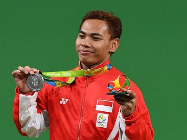 Indonesia meraih medali kedua di ajang Olimpiade Rio de Janeiro 2016 setelah lifter Eko Yuli Irawan menyabet medali perak di cabang angkat besi kelas 62 kg, Selasa (9/8/2016) pagi WIB. (AFP/Goh Chai Hin)