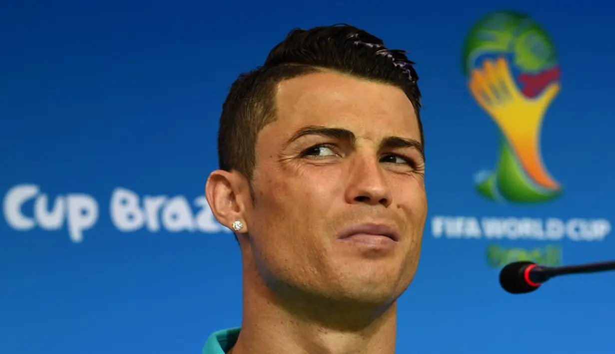 CR7 sesumbar akan menjadikan Jerman sebagai korban pertama dalam petualangan mereka di Grup G, Brasil, Minggu (15/6/2014) (AFP Photo/FRANCISCO LEONG)