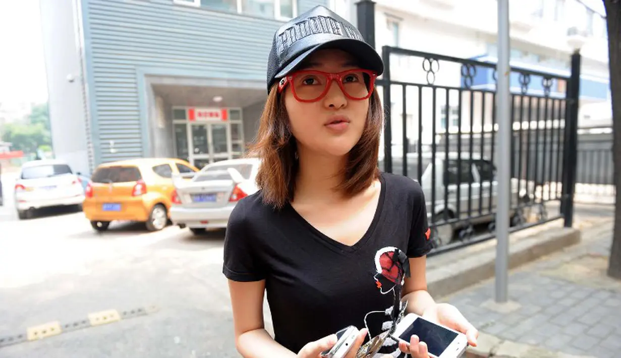 Selain menjalani bisnis judi ilegal, wanita 23 tahun itu mengaku meraup banyak uang karena bekerja sebagai wanita panggilan. (CHINA OUT AFP PHOTO)