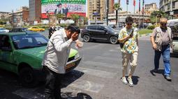 Gelombang panas yang berkepanjangan telah memicu kekurangan air dan listrik di berbagai wilayah Iran. (Foto oleh AFP)