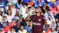 Paulinho rayakan gol kemenangan untuk Barcelona ( PIERRE-PHILIPPE MARCOU / AFP)
