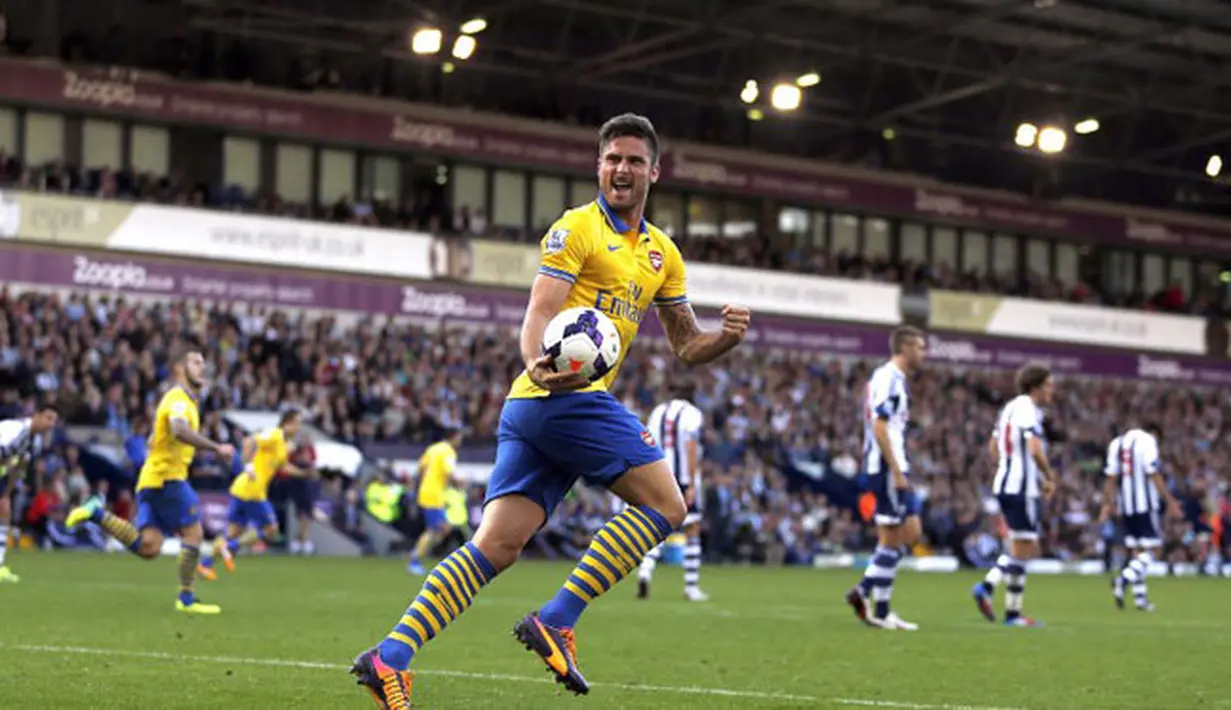 Striker Arsenal Olivier Giroud merlakukan selebrasi setelah rekan setimnya Jack Wilshere berhasil menjebol gawang West Bromwich Albion (06/10/2013). (AFP
