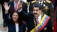 Presiden Venezuela Nicolas Maduro dan istrinya Cilia Flores (AFP Photo/Federico Parra)
