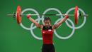 Total angkatan Sriw Wahyuni itu lebih ringan delapan kg dari lifter Thailand, Sopita Tanasan, yang membukukan 200 kg (92 kg Snatch dan 108 kg Clean & Jerk) untuk menyabet emas. (AFP/Goh Chai Hin)