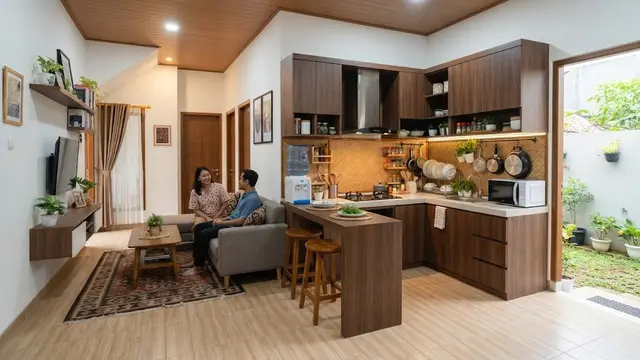 Desain rumah 3 kamar yang tetap lega tanpa menambah luas bangunan model dapur terbuka di samping ruang keluarga