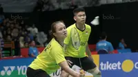 Ganda Campuran Indonesia, Praveen Jordan dan Melati Daeva menang atas pasangan Korea, Seo Seung-jae dan Kim Ha-na pada babak kedua Daihatsu Indonesia Master 2018 di Istora Senayan, Kamis (25/1/2018). Praveen/Melati menang 221-15 21-16. (Bola.com/Nick Hano