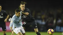 Penyerang Real Madrid, Gareth Bale tampil superior kontra Celta Vigo pada laga lanjutan pekan ke-12 La Liga 2018/19, Senin (12/11) yang berlangsung di stadion Balaidos, Spanyol. Real Madrid menang 4-2. (AFP/Miguel Riopa)