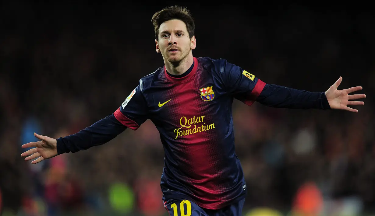 Jumlah gol terbanyak Lionel Messi dalam setahun adalah 79 gol yang dibuatnya pada tahun 2012 bersama Barcelona. Sementara gol terbanyak yang dicetak Cristiano Ronaldo hanya 59 gol bersama Real Madrid pada tahun 2013. (AFP/Lluis Gene)