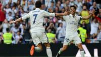 Dua pemain Real Madrid Cristiano Ronaldo (kiri) dan Marco Asensio (kanan). (AFP/Cesar Manso)