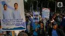 Peserta aksi juga terlihat membawa poster yang berisi ajakan untuk menolak pelbagai ujaran kebencian di akhir masa jabatan Jokowi-Ma'ruf Amin. (Liputan6.com/Angga Yuniar)