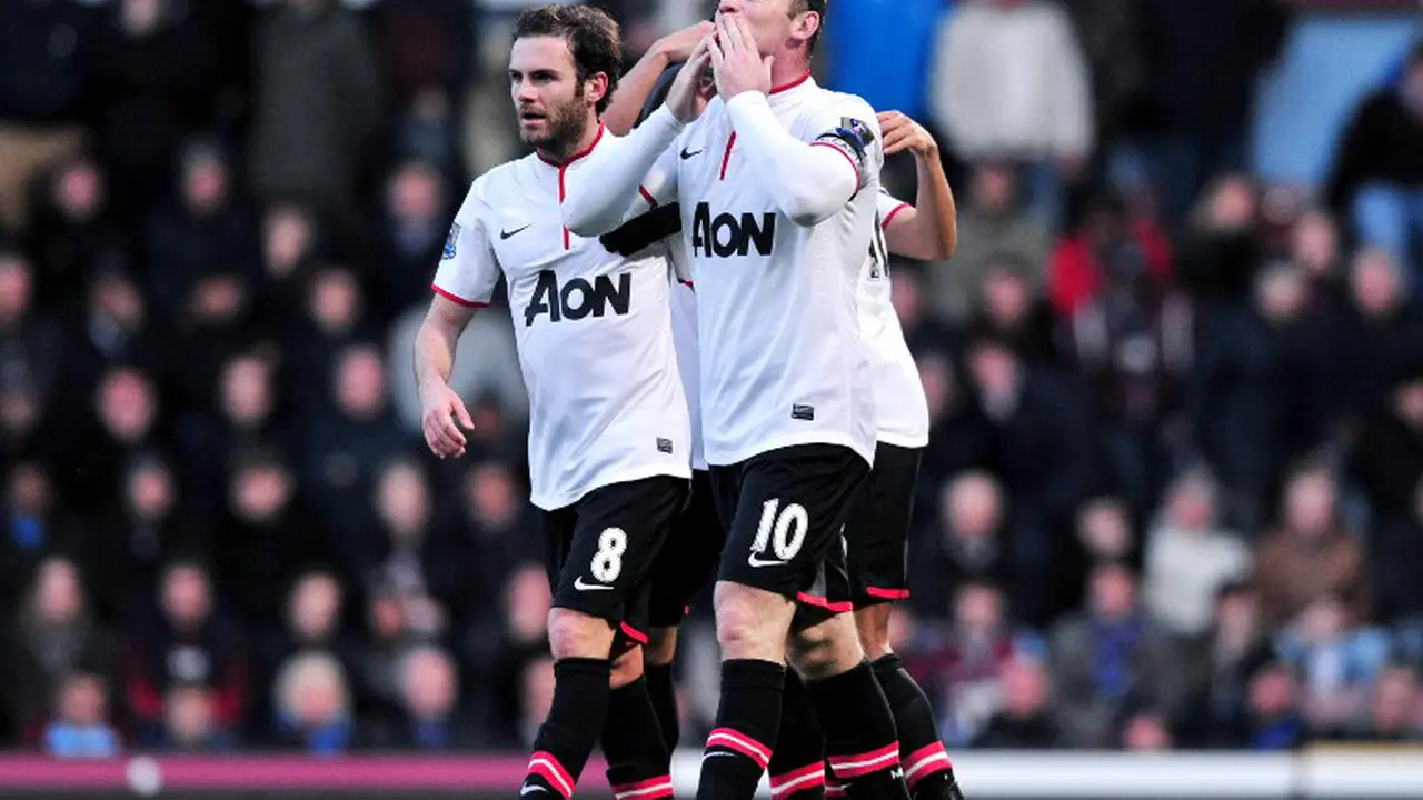 Juan Mata & Wayne Rooney (Carl Court / AFP)