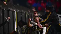 Bek Juventus Federico Gatti merayakan suksesnya ketika mencetak gol kemenangan timnya atas Monza di lanjutan Liga Italia 2023/2024 hari Sabtu (02/12/2023) dini hari WIB. (Marco BERTORELLO / AFP)