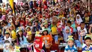 Sebanyak 1000 anak-anak sarapan Koko Krunch bersama di Keong Mas, TMII, Sabtu (13/02). Acara yang digelar dalam rangka Kampanye Pekan Sarapan Nasioan (PESAN) diikuti dari berbagai wilayah seJabodetabek (Liputan6.com/Fery Pradolo)