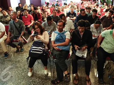 Wajib pajak antusias mengikuti pelaksanaan program tax amnesty di kantor pusat Ditjen Pajak, Jakarta, Minggu (25/9). Mengantisipasi lonjakan pendaftar, DJP membuka tempat pendaftaran program pada Sabtu-Minggu pukul 08.00-14.00. (Liputan6.com/Fery Pradolo)