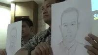 Polisi menunjukkan sketsa wajah pelaku bom di Gresik (Liputan6.com / Dian Kurniawan)