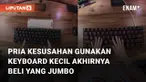 Aksi pria memiliki tubuh besar dan tinggi beli keyboard jumbo mengundang perhatian