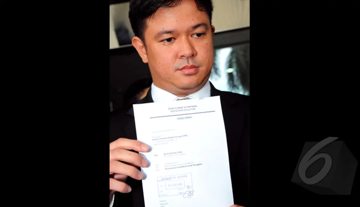 Melalui tim kuasa hukumnya, Andreas Nahot Silitonga mantan Menteri Agama Suryadharma Ali (SDA) menyatakan tidak dapat hadir karena belum paham dengan surat panggilan KPK, Jakarta, Rabu (4/2/2015). (Liputan6.com/Faisal R Syam)