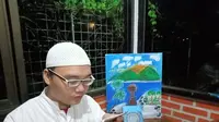 Nazario Prianggara Kurniawan penyandang autisme yang bacakan surat Yasin untuk Syekh Ali Jaber. Foto: Yati Mulyati.