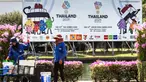 Aktivitas pekerja kebun di dekat papan reklame SEA Games 2025 di luar Stadion Nasional Rajamangala, Bangkok, Thailand pada Jumat 28 November 2025. Thailand berhias menyambut perhelatan olahraga terbesar se-Asia Tenggara (SEA Games) 2025. (Chanakarn Laosarakham/AFP)
