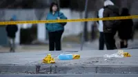 Garis polisi terdapat di trotoar, lokasi penabrakan van ke pejalan kaki di Toronto, Kanada. Insiden terjadi pada 23 April 2018 (Cole Burston/Getty Images/AFP  Cole Burston / GETTY IMAGES NORTH AMERICA / AFP)