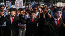 Dalam aksinya menyampaikan orasi terkait capaian pemerintahan Joko Widodo-Ma'ruf Amin. (Liputan6.com/Angga Yuniar)