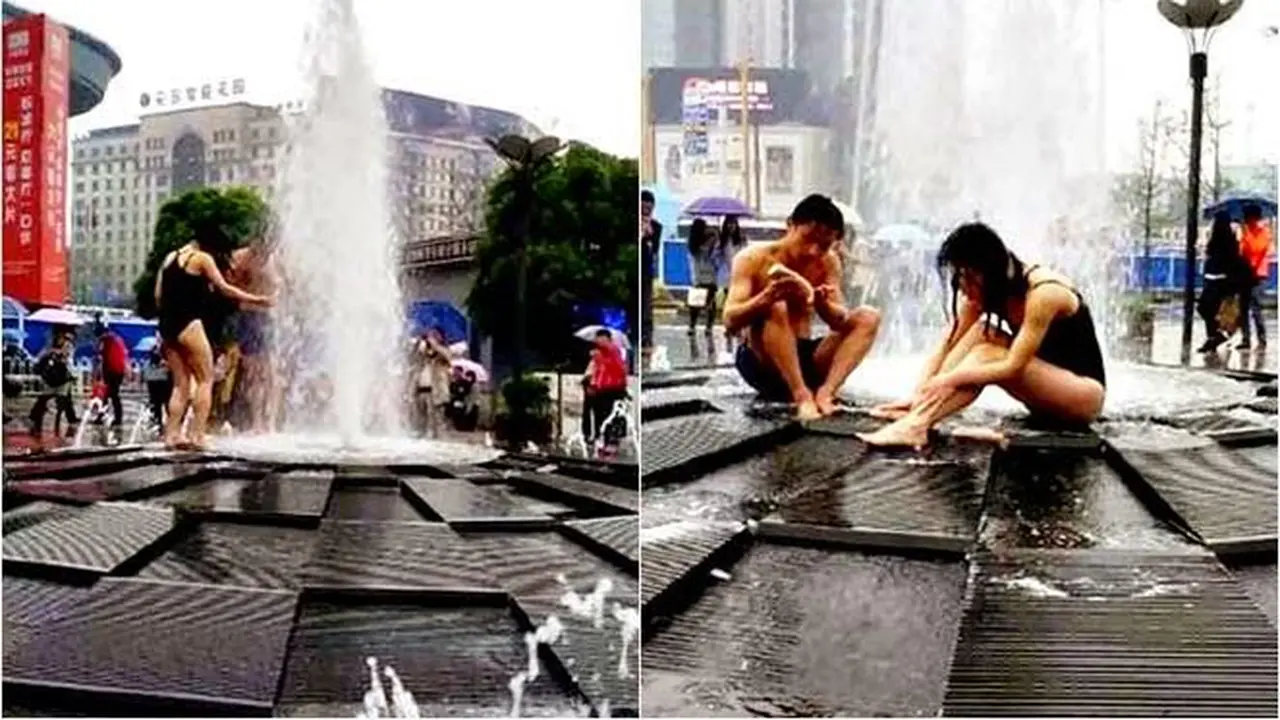 Tak Punya Air, Pasangan Ini Nekat Mandi di Air Mancur Kota