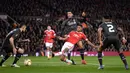 Striker MU, Marcus Rashford, berusaha membobol gawang Liverpool pada laga leg kedua babak 16 besar Liga Europa di Stadion Old Trafford, Inggris, Jumat (17/3/2016) dini hari WIB. (AFP/Oli Scarff)