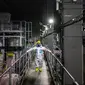 Kenichi Takahara, komunikator risiko dari perusahaan teknik dekontaminasi dan dekomisioning Fukushima Daiichi, mengunjungi sistem penghilangan multi-nuklida di Pembangkit Listrik Tenaga Nuklir (PLTN) Fukushima Daiichi milik Tokyo Electric Power Company (TEPCO) di Okuma, Prefektur Fukushima, Jepang, 20 Januari 2023. Situs ini menghasilkan 100.000 liter (3.500 kaki kubik) air yang terkontaminasi setiap hari. (Philip FONG/AFP)