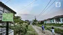 Anak-anak saat bermain di perumahan subsidi Green Citayam City, Ragajaya, Bojong Gede, Kabupaten Bogor, Jawa Barat, Sabtu (13/2/2021). PT BTN Tbk optimis realisasi Kredit Pemilikan Rumah atau KPR mencapai 200-250 ribu unit pada 2021. (merdeka.com/Iqbal S Nugroho)