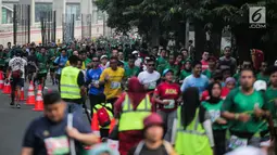 Ribuan peserta mengikuti lomba lari Milo Jakarta International 10K di kawasan Rasuna Epicentrum, Jakarta, Minggu (14/7/2019). Milo Jakarta International 10K diikuti oleh sekitar 16 ribu peserta. (Liputan6.com/Faizal Fanani)