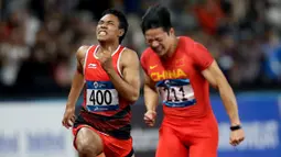 Pelari Indonesia, Lalu Muhammad Zohri, saat berlaga pada nomor 100 meter Asian Games di SUGBK, Jakarta, Minggu (26/8/2018). Lalu Zohri finish diurutan ke tujuh dengan catatan waktu 10,20 detik. (Bola.com/Peksi Cahyo)