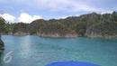 Suasana pemandangan Pulau Piaynemo di Kabupaten Raja Ampat, Papua Barat. Pulau ini menjadi salah satu ikon Raja Ampat dan tempat favorit para turis untuk berfoto-foto. (Liputan6.com/Zulfi Suhendra)