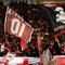 Suporter klub AC Milan memenuhi tribun selatan Stadion GBK Jakarta, (7/6/2014), untuk menyaksikan aksi para legenda sepakbola dunia yang didominasi mantan pemain klub asal Italia tersebut. (Liputan6.com/Helmi Fithriansyah)