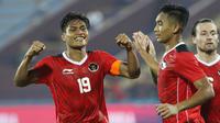Selebrasi pemain timnas Indonesia Fachruddin Aryanto melakukan selebrasi usai menjebol gawang Timor Leste dalam pertandingan lanjutan babak penyisihan grup A Sea Games 2021 Vietnam di Viet Tri Stadium, Phu Tho, Vietnam, Selasa (10/5/2022). (Bola.com/Ikhwan Yanuar)