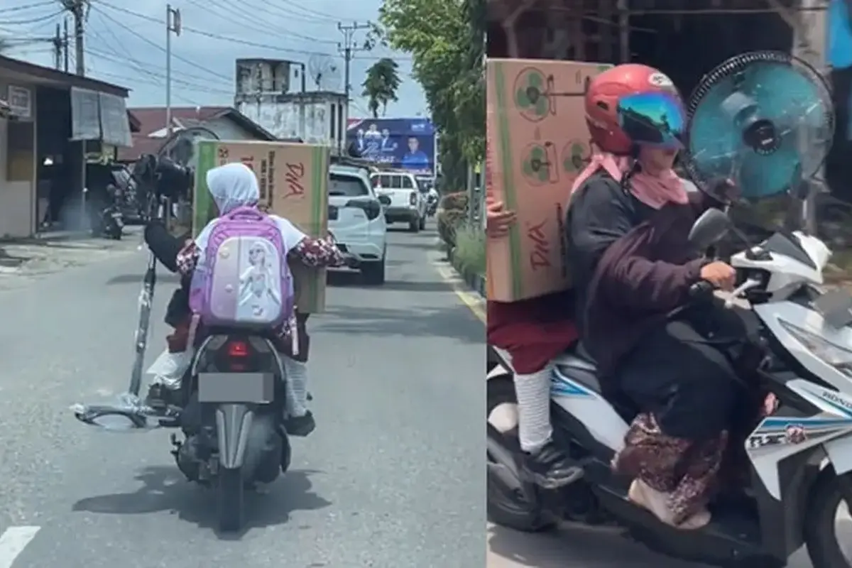 Tak Ada Lawan, Ibu-Ibu Bonceng Anak Sambil Bawa Kipas Angin Besar yang Sudah Dirakit