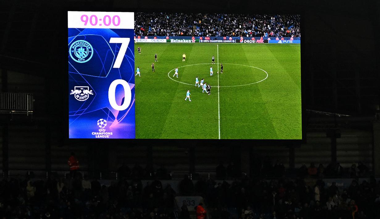 <p>Papan skor pada laga leg kedua 16 Besar Liga Champions 2022/2023 antara Manchester City melawan RB Leipzig di Etihad Stadium, Manchester, Rabu (15/03/2023). The Cityzens berhasil melaju ke babak perempat final setelah berhasil menang dengan skor 7-0. (AFP/Oli Scarff)</p>