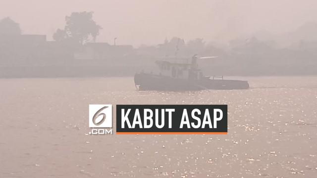 Kabut asap dari kebakaran hutan dan lahan, mulai berdampak bagi aktivitas warga Pontianak, Kalimantan Barat pada Jumat (6/9/2019) pagi.