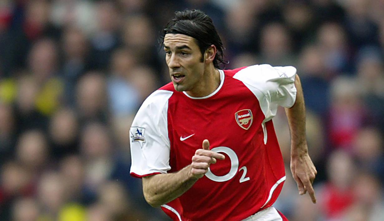 Robert Pires - Gelandang asal Prancis ini  menjalani era kejayaannya bersama Arsenal pada tahun 2000-2006. Pires menyumbangkan dua gelar Liga Inggris dan dua Piala FA untuk Arsenal. (AFP/Odd Andersen)