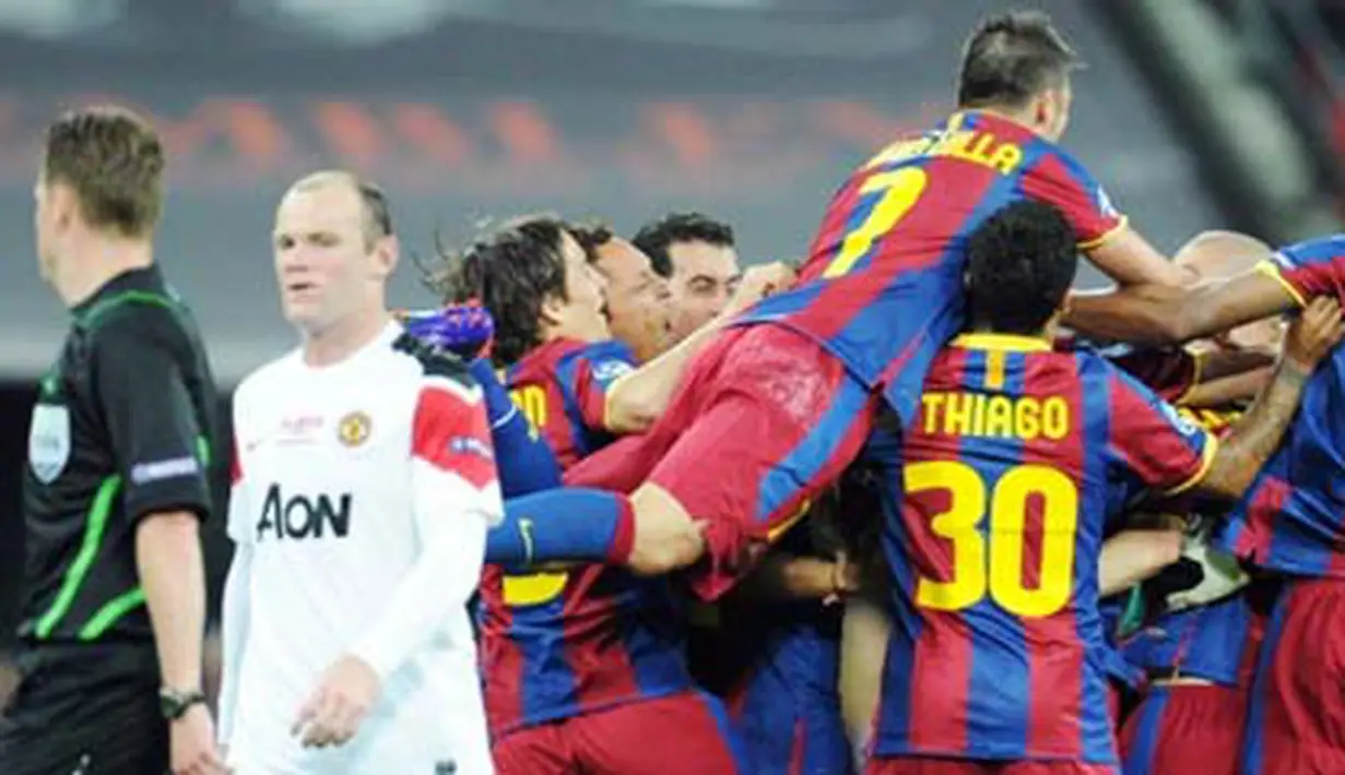 Para pemain Barcelona serentak bergembira usai mengalahkan Manchester United 3-1 pada partai final Liga Champions di Wembley Stadium, 28 Mei 2011. AFP PHOTO/FRANCK FIFE