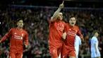 Gelandang Liverpool, James Milner, merayakan gol yang dicetak ke gawang Augsburg pada laga babak 32 besar Liga Europa di Stadion Anfield, Inggris, Kamis (25/2/2016). The Reds berhasil lolos ke 16 besar berkat agregat skor 1-0. (EPA/Peter Powell) 