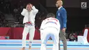 Atlet Jujitsu putri Indonesia Simone Julia terlihat kecewa saat bertanding melawan Tsogkhuu Udval dari Mongolia pada nomor final putri 62 kg Asian Games 2018, Jakarta, Sabtu (25/8). Simone gagal mempersembahkan medali perunggu. (Merdeka.com/Arie Basuki)
