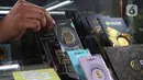 Berdasar informasi dari laman resmi Pegadaian, harga per 1 gram emas Antam, Rabu (14/5/2025), dijual Rp1.960 juta atau turun Rp20 ribu dari hari sebelumnya. (Liputan6.com/Angga Yuniar)