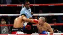 Petinju Indonesia Daud Yordan (kiri) saat bertanding melawan Yoshitaka Kato pada Road to the World Champions, Jakarta, Jumat (5/2). Dalam Pertandingan WBO (The World Boxing Organization) ini di menangkan oleh Daud Yordan. (Liputan6.com/Johan Tallo)